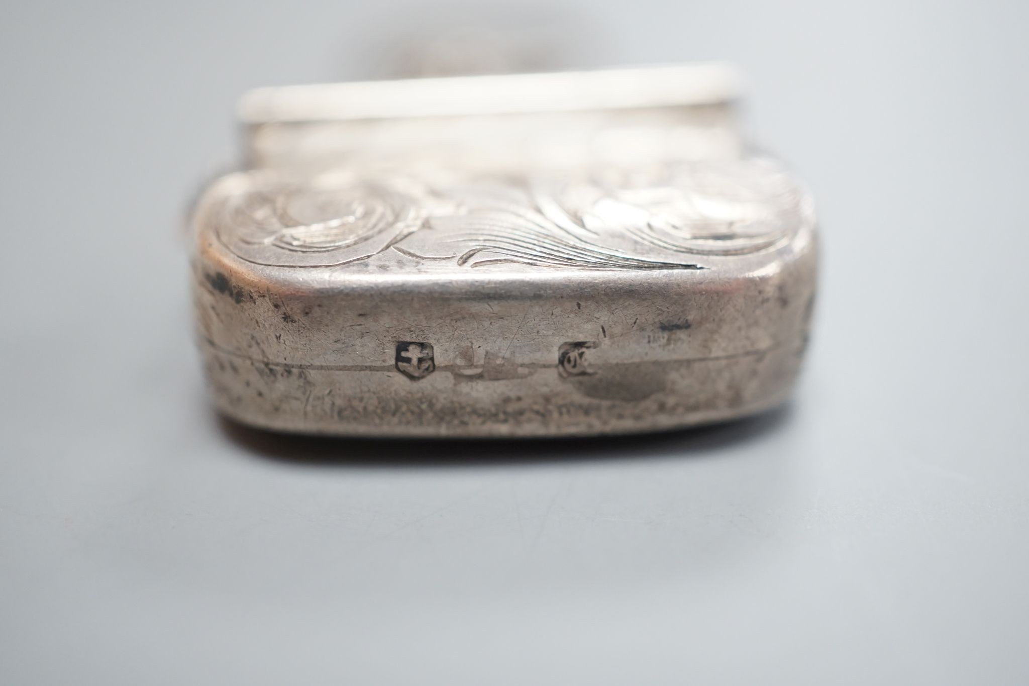 A Victorian novelty silver vinaigrette, modelled as a handbag, John Tongue, Birmingham, circa, 1840 (date letter rubbed), width 27mm.